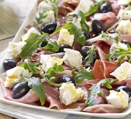 Serrano ham, olive, feta & rocket platter with homemade crostini recipe 
