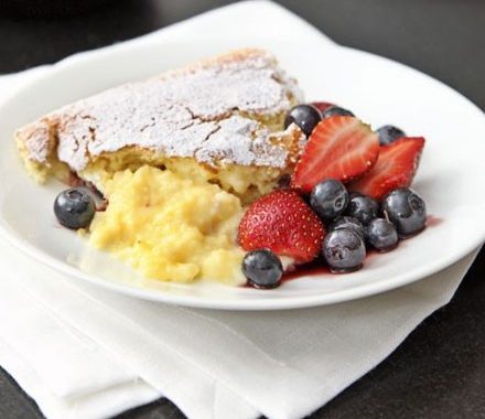 Luscious lemon pudding with summer berries recipe
