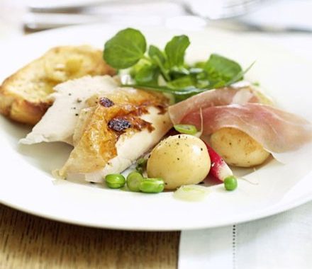 Herby roast chicken with garlic lemon toasts recipe