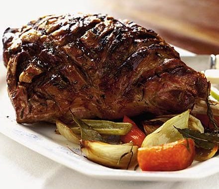 Roast spring lamb with rosé wine & oranges recipe