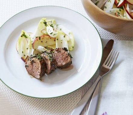 Herby pork with apple & chicory salad recipe