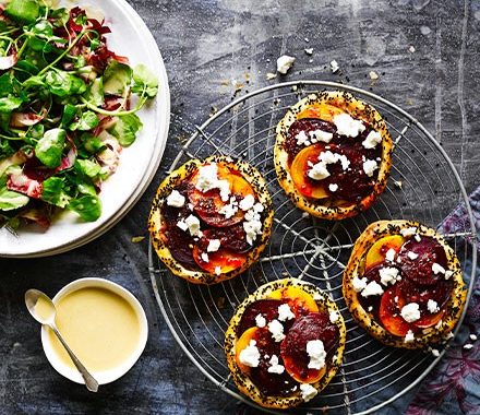 Spiced beetroot & feta tarts with tahini-dressed leaves recipe