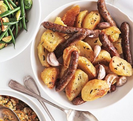 Rosemary & garlic roast potatoes with chipolatas recipe 